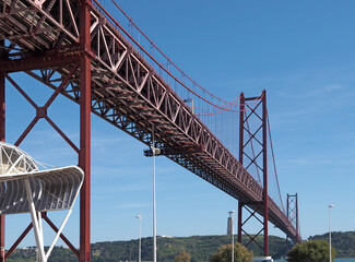 Seagull flying over red bridge ponte 25 de abril