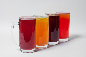 craft and colored beer set in mugs isolated