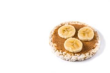 Puffed rice cake with banana and peanut butter isolated on white background.Copy space