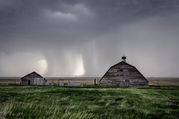 Old, Abandoned Structures on the Great Plains as Storms Approach