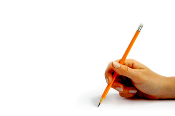 Female hand holds an orange pencil on a white background
