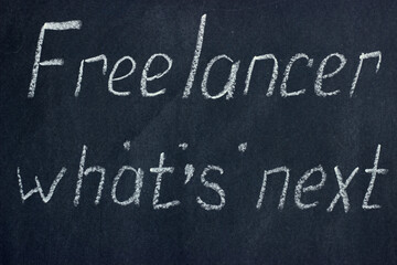 Fototapeta premium The inscription on the chalk board Freelancer, what's next. Refinement of plans