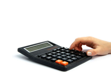 female female finger presses buttons on a large calculator white background
