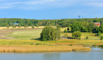 Fototapeta na wymiar Summer landscape. Picturesque fields and pastures on shores of Baltic Sea. Turku Archipelago, Finland