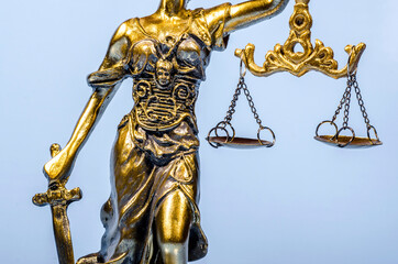 Details of Statue of Justice on the blue background