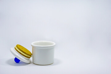 White porcelain pot with a blue knob on the lid isolated on white background.