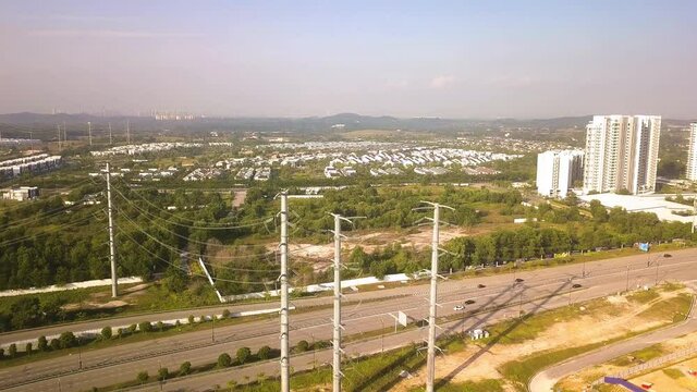 Aerial shot of power lines over highway  Malaysia