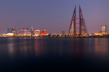 Fototapeta na wymiar Bahrain Sklyine during dusk with illuminated buildings