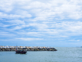 A fishing boat floating on the sea, complete with fishing equipment