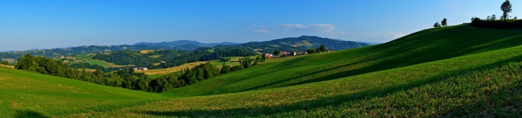 Fototapeta na wymiar green hills panorama in the countryside landscape