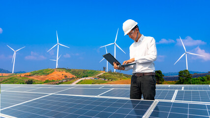 Electrical engineers are using tablets to monitor the operation of the solar cells. Renewable...