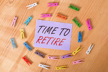 Handwriting text Time To Retire. Conceptual photo bank savings account, insurance, and pension planning Colored clothespin papers empty reminder wooden floor background office