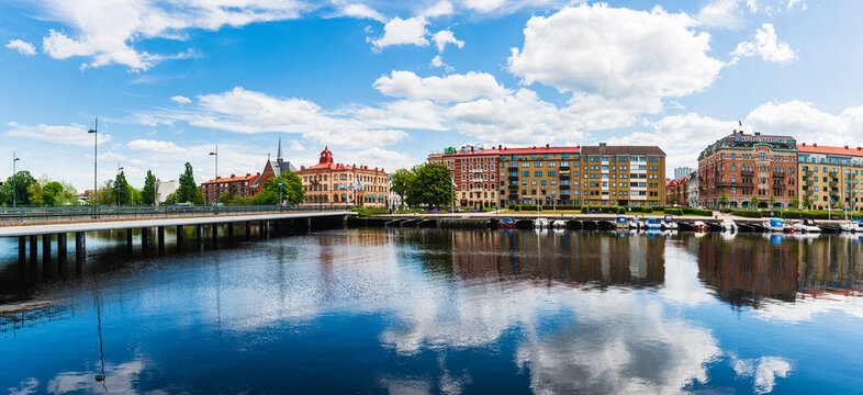 Buildings at Halmstad city in front of still river, Sweden