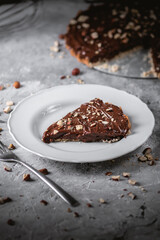 Delicious hazelnut chocolate tart, topped with nuts