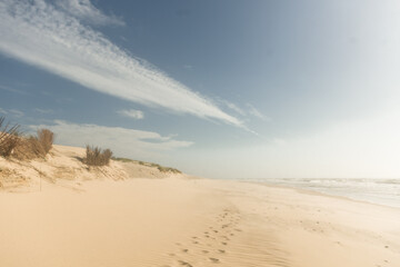Fototapeta na wymiar sand dunes and sky on the beach