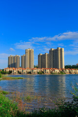 Green living building residential area under the blue sky and white clouds.