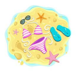 Flip flops and swimsuit on the beach sand