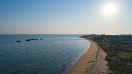 Aerial photo of sailing lighthouse by the sea