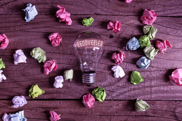 Fototapeta na wymiar Conceptual hand writing showing Recoveries. Concept meaning process of regaining possession or control of something lost Realistic colored vintage light bulbs, idea sign solution