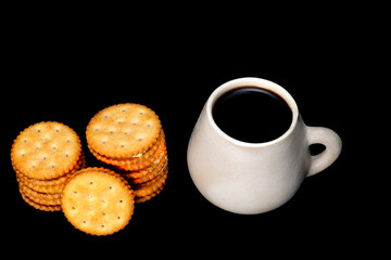 white plate with lemon cookies with cup of coffee seen from above