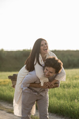 Young lovely couple. Man holds girlfriend. Soft selective focus.