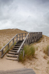 Fototapeta na wymiar The wooden stairs on the 26 m high panorama dune, Petten aan Zee.