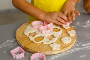 Obraz na płótnie Canvas Little girl make cookies at the advent time.