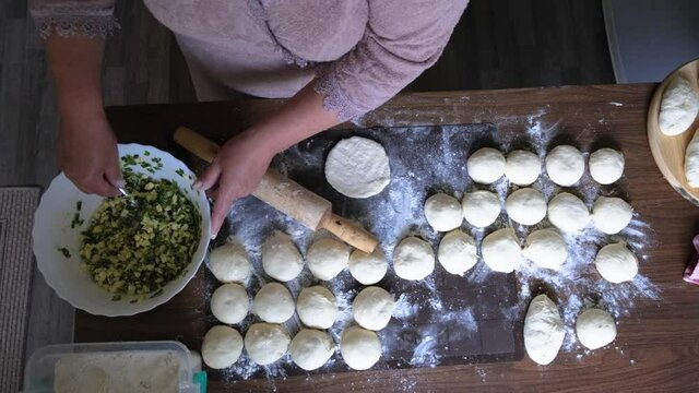 Woman making pies in the kitchen
