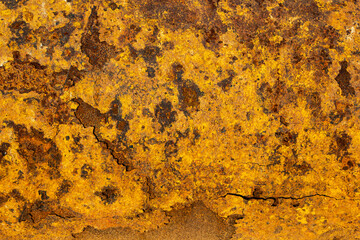 A rusty metal iron with a decorative pattern