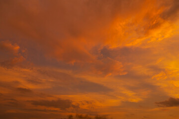 unusually beautiful fiery red tropical sunset. Burning clouds. Fire in the sky