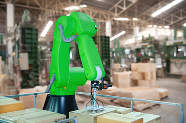 The Robotic arms carries cardboard box for delivery industry packing