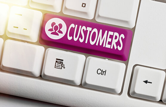 Handwriting text Customers. Conceptual photo individual or organization purchasing products or services Different colored keyboard key with accessories arranged on empty copy space