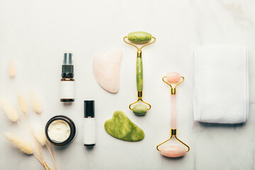 Jade face rollers and Gua sha stones for beauty facial massage therapy, Items for home treatment with Skin Care Anti-Aging Tools, Headband, Face Serum, Coconut Oil and Moisturiser Cream