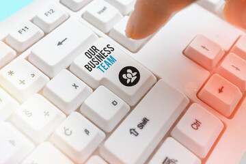 Handwriting text writing Our Business Team. Conceptual photo meeting and brainstorming, strategic partnership, crowdfunding, success Pc keyboard key with pointing finger above background copy space