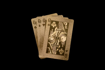 Golden poker deck, on black background with queens