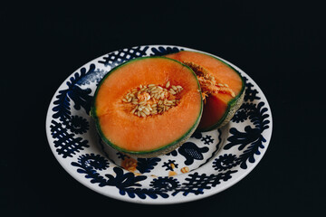 Isolated sweer melon on a plate