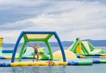 Children play in a colorful playroom on the water