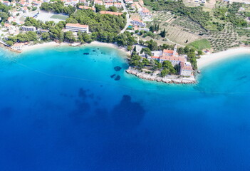 Aerial view on amazing beautiful beach and the small church of St.Ivan and Teodora on Island Brac,Bol.Copy space image