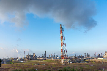 Fototapeta na wymiar The petrochemical refinery is under blue sky and white clouds.