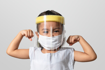 A girl wearing a mask to protect the COVID-19 virus.