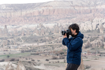 Photographer shooting picturesque hills