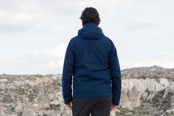 Tourist standing on top of hill