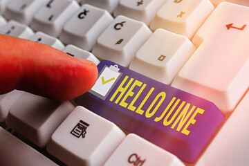 Word writing text Hello June. Business photo showcasing a new month to plan your activities for fun and adventures White pc keyboard with empty note paper above white key copy space