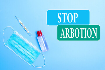 Writing note showing Stop Arbotion. Business concept for advocating against the practice of...