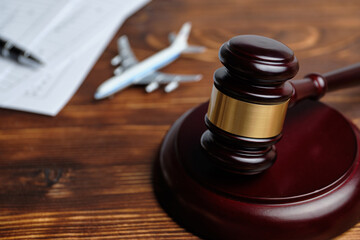 The concept of revoking a flight license next to a judge hammer