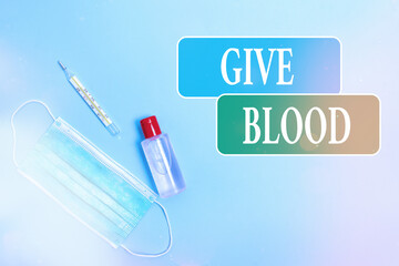 Writing note showing Give Blood. Business concept for an individual voluntarily has blood drawn and...