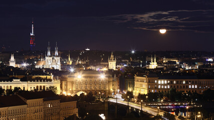 Fototapeta na wymiar Prague cityscape at full moon night, Czech Republic.