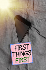 Conceptual hand writing showing First Things First. Concept meaning Business, technology, internet,...