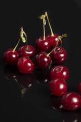 Cherries on the black backdrop with nice reflection