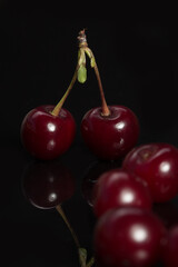 Cherries on the black backdrop with nice reflection